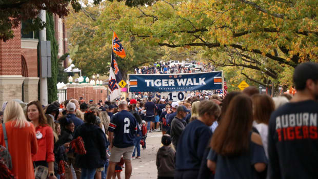 The Auburn fans gather for Tiger Walk before the Tigers and the Razorbacks clash.